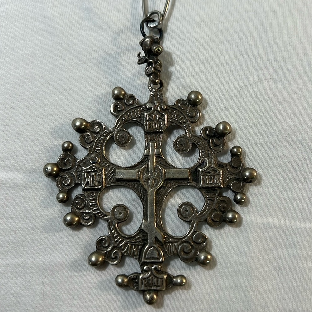 Large, ornate, silver/black metal cross pendantt